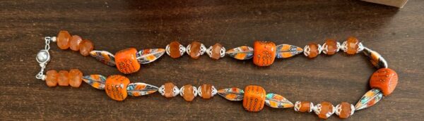 Luxury Artisan Orange Glass Necklace with exquisite feather beads of inlaid organics