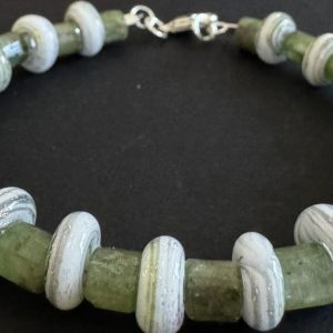 White Donut shaped artisan glass beaded bracelet with green markings
