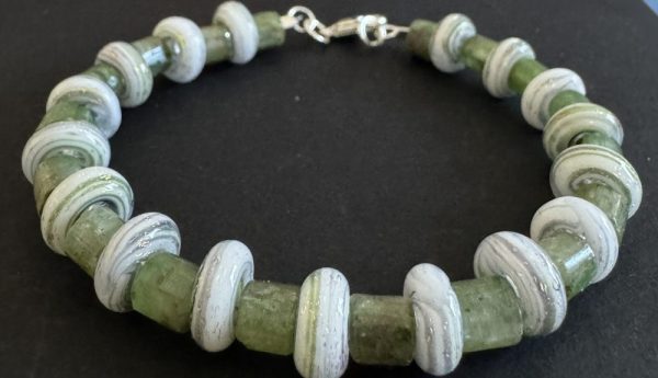 White Donut shaped artisan glass beaded bracelet with green markings